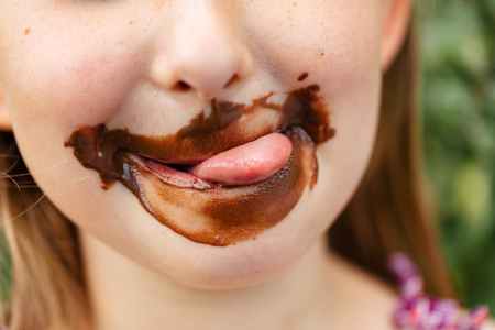 little girl with chocolate covered face